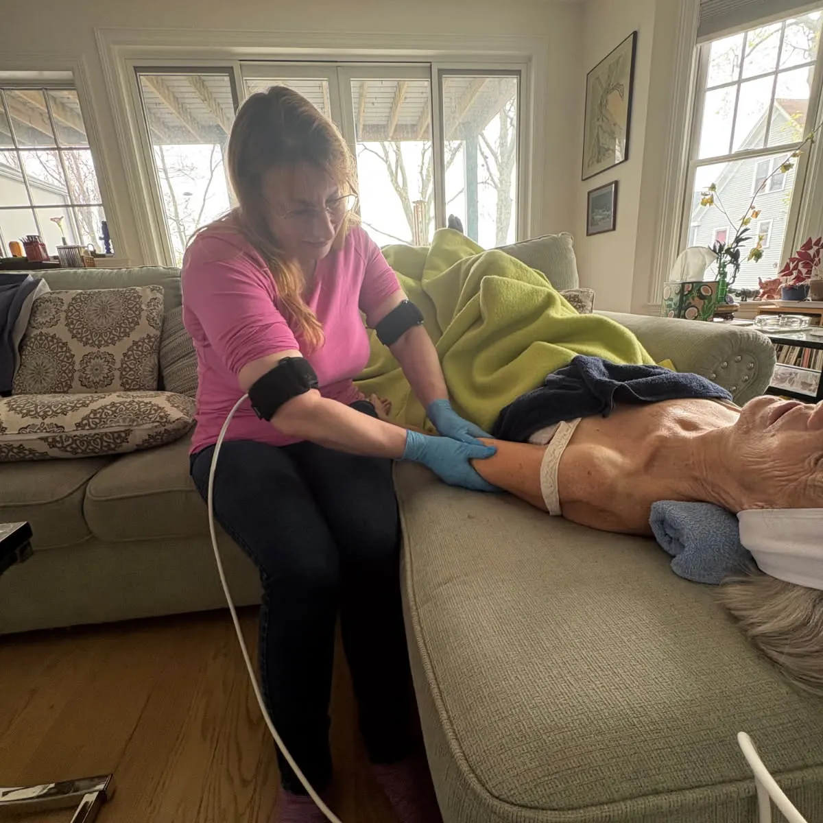 Client receiving a WonderTouch treatment at home